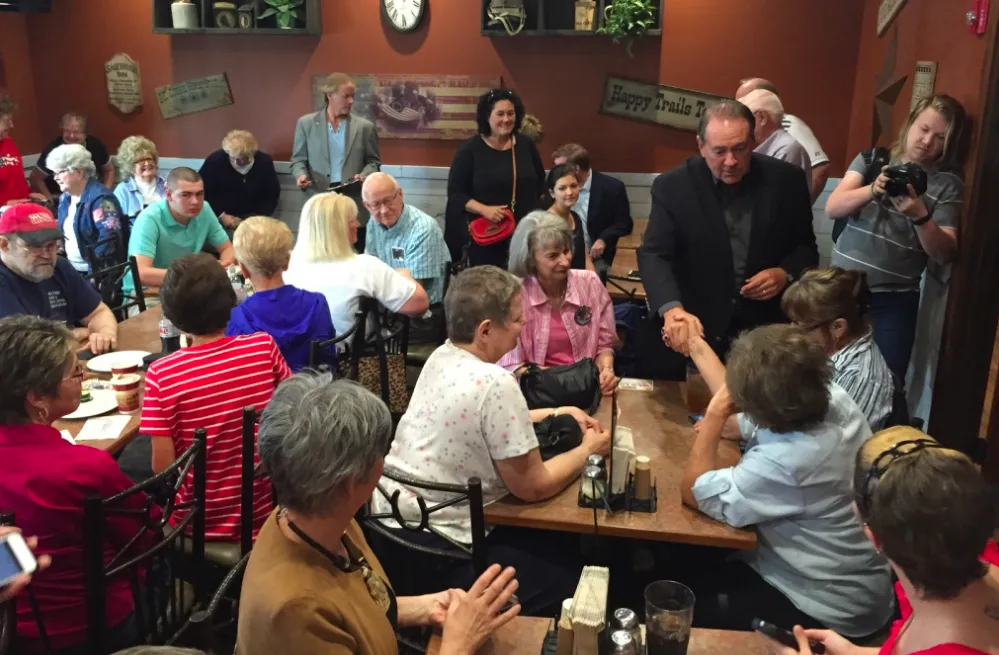 Mike Huckabee campaigns at a Pizza Ranch in Cedar Rapids, Iowa.
