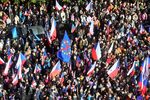 Protesters wave Czech national flags as they take part in rally against the Czech government in Prague on Sept. 28.
