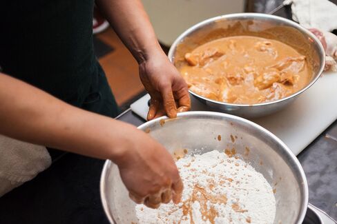 To create extra crunch, López-Alt mixes some buttermilk brine with flour before dredging the chicken.