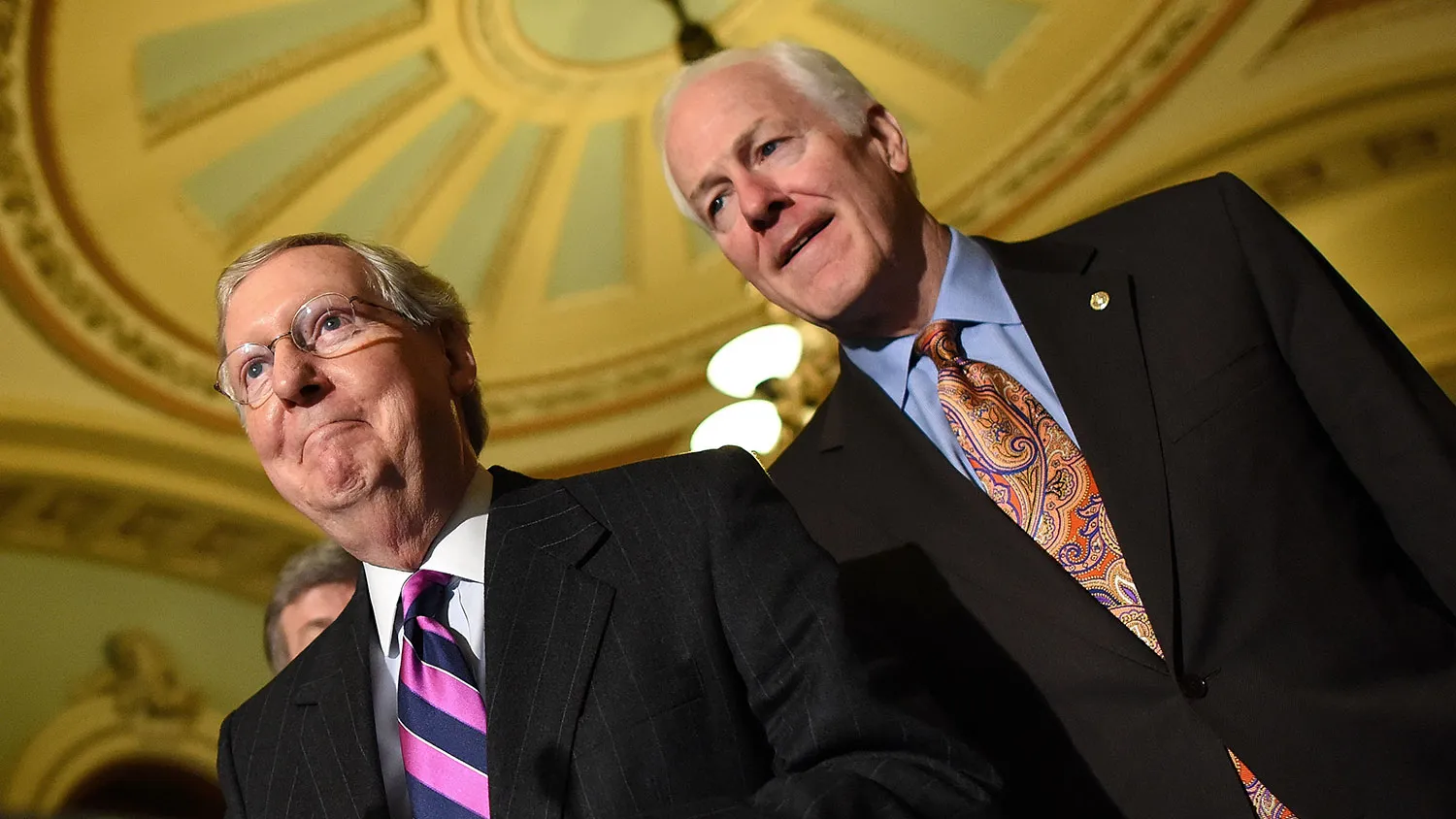 Senate Minority Leader Mitch McConnell (L) (R-KY) answers questions with members of the Republican senate leadership following the weekly Republican policy luncheon at the U.S. Capitol November 18, 2014 in Washington, DC.
