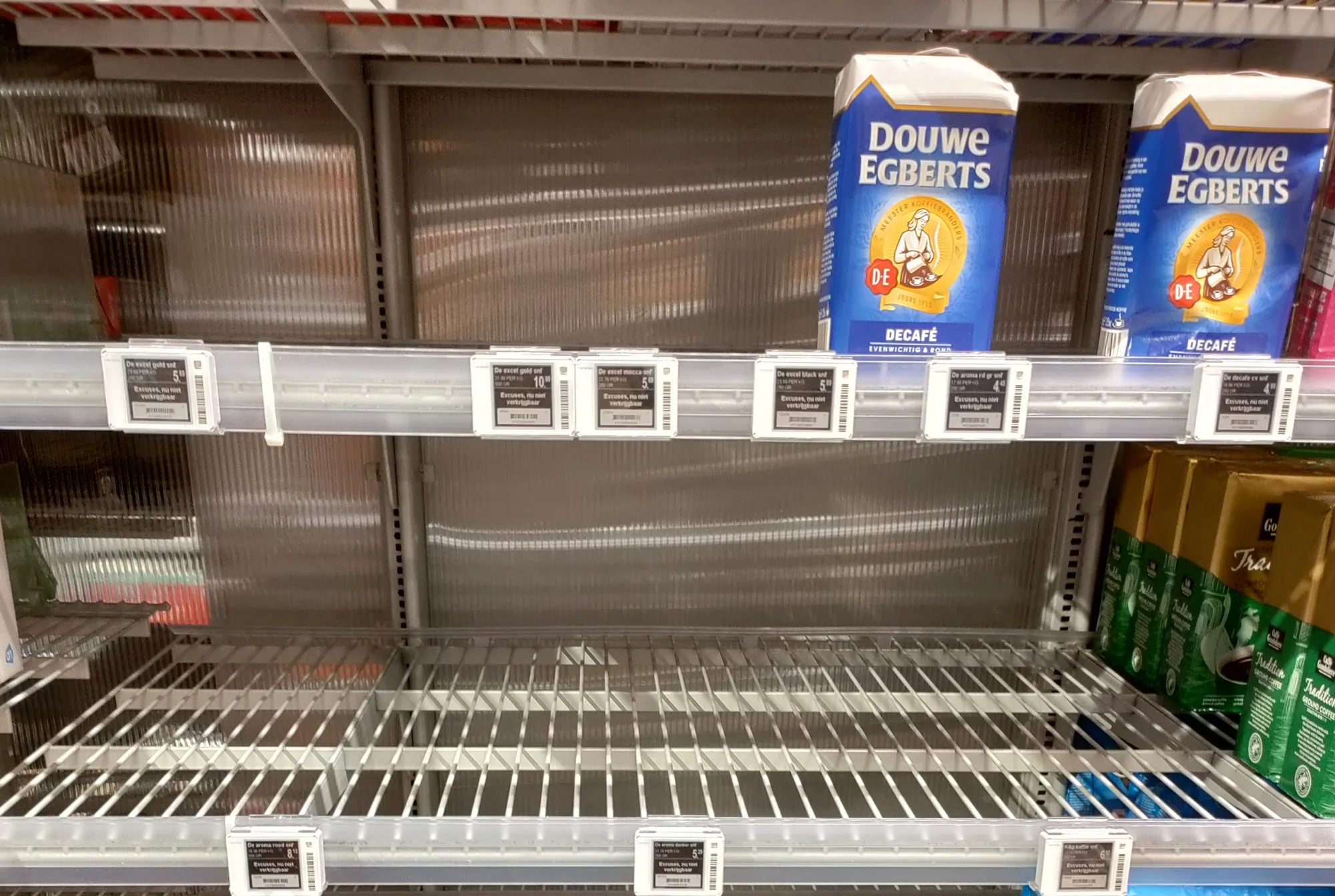 Empty shelves in the coffee aisle of a supermarket in Utrecht.