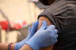 A child receives a bandage after recieving a&nbsp;vaccine&nbsp;in Los Angeles.