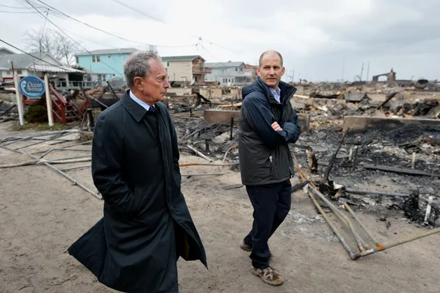 New York City Mayor Michael Bloomberg views damage from Hurricane Sandy in the Breezy Point are of Queens, NY on Oct. 30, 2012
