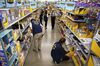 Employees restock shelves of school supplies at a Wal-Mart Stores Inc. location in Burbank, California, U.S., on Tuesday, Aug. 8, 2017. Wal-Mart Stores is scheduled to release earnings figures on August 17.
