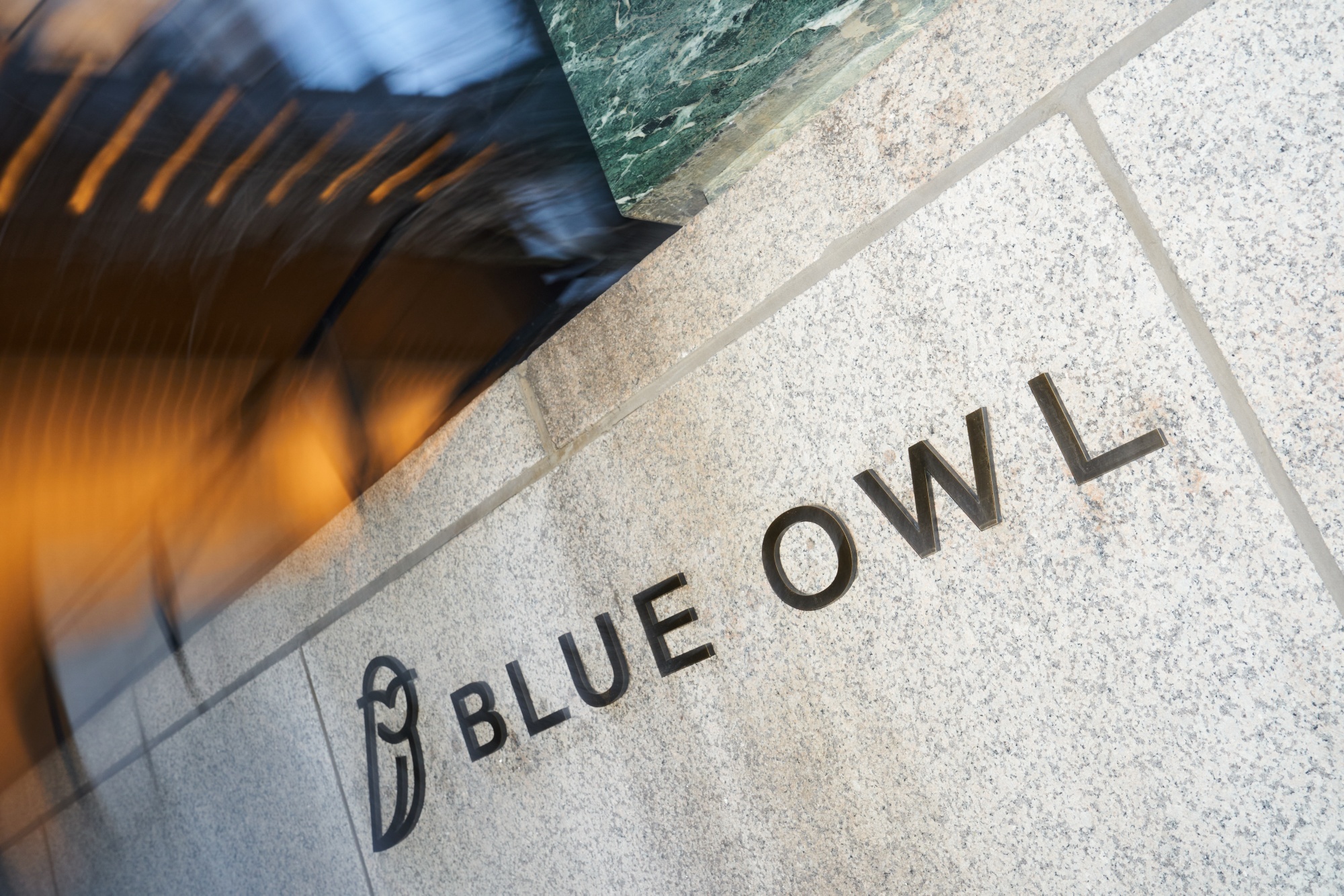 Blue Owl signage outside the Seagram Building at 375 Park Avenue in the Midtown East neighborhood of New York, US, on Tuesday, Jan. 20, 2026. A Blue Owl Capital Inc. private credit fund has launched its first dollar bond in a year, during a session in which global market jitters kept other potential borrowers on the sidelines. Photographer: Bing Guan/Bloomberg