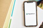 The logo for Tripadvisor Inc. is displayed on a smartphone in an arranged photograph taken in the Brooklyn borough of New York, U.S., on Sunday, May 10, 2020. In a matter of months, the coronavirus reset the clock on a decades-long aviation boom that's been one of the great cultural and economic phenomena of the postwar world. Photographer: Gabby Jones/Bloomberg