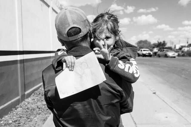 Pedro Tonito carries his daughter Fernanda, 5-years old, toward a crossing point in Ciudad Juárez, Mexico, on April 10. 