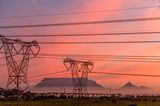 Table Mountain beyond high-voltage electricity transmission towers in Cape Town.&nbsp;