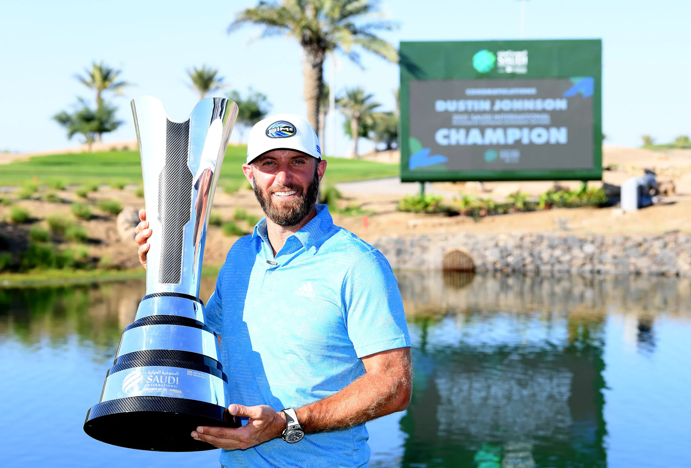 Dustin Johnson with his 2021 Saudi International trophy.