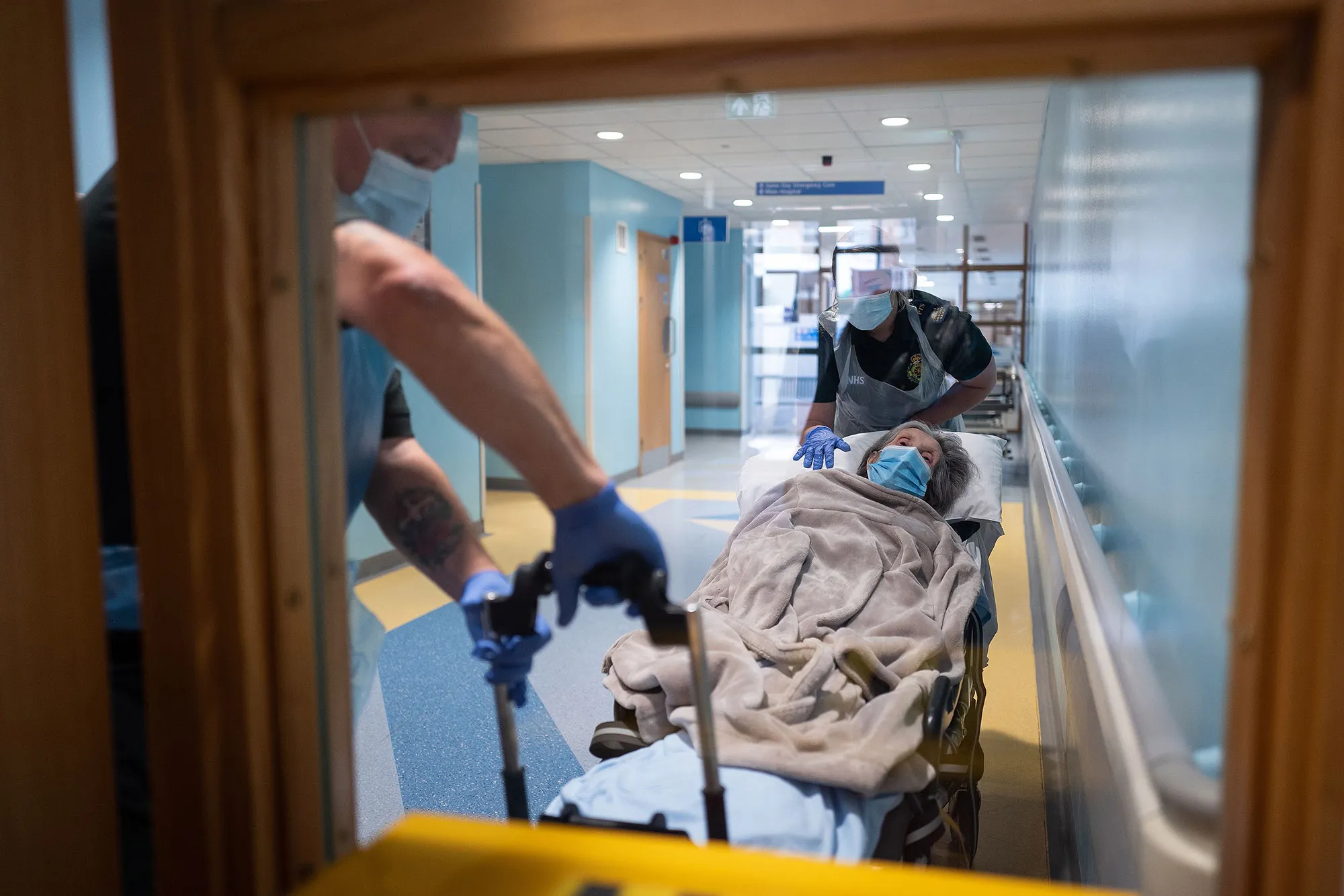 South Central Ambulance Services move an elderly patient from hospital to a care home near Portsmouth.
