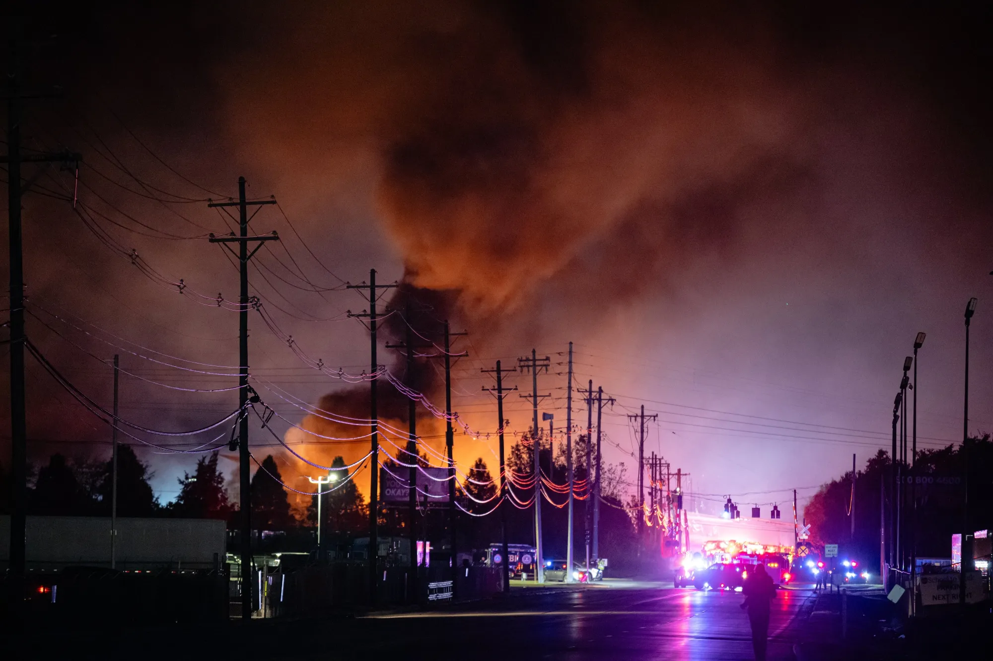 Plumes of smoke rise from the area of a UPS cargo plane crash at Louisville Muhammad Ali International Airport on Nov. 4.