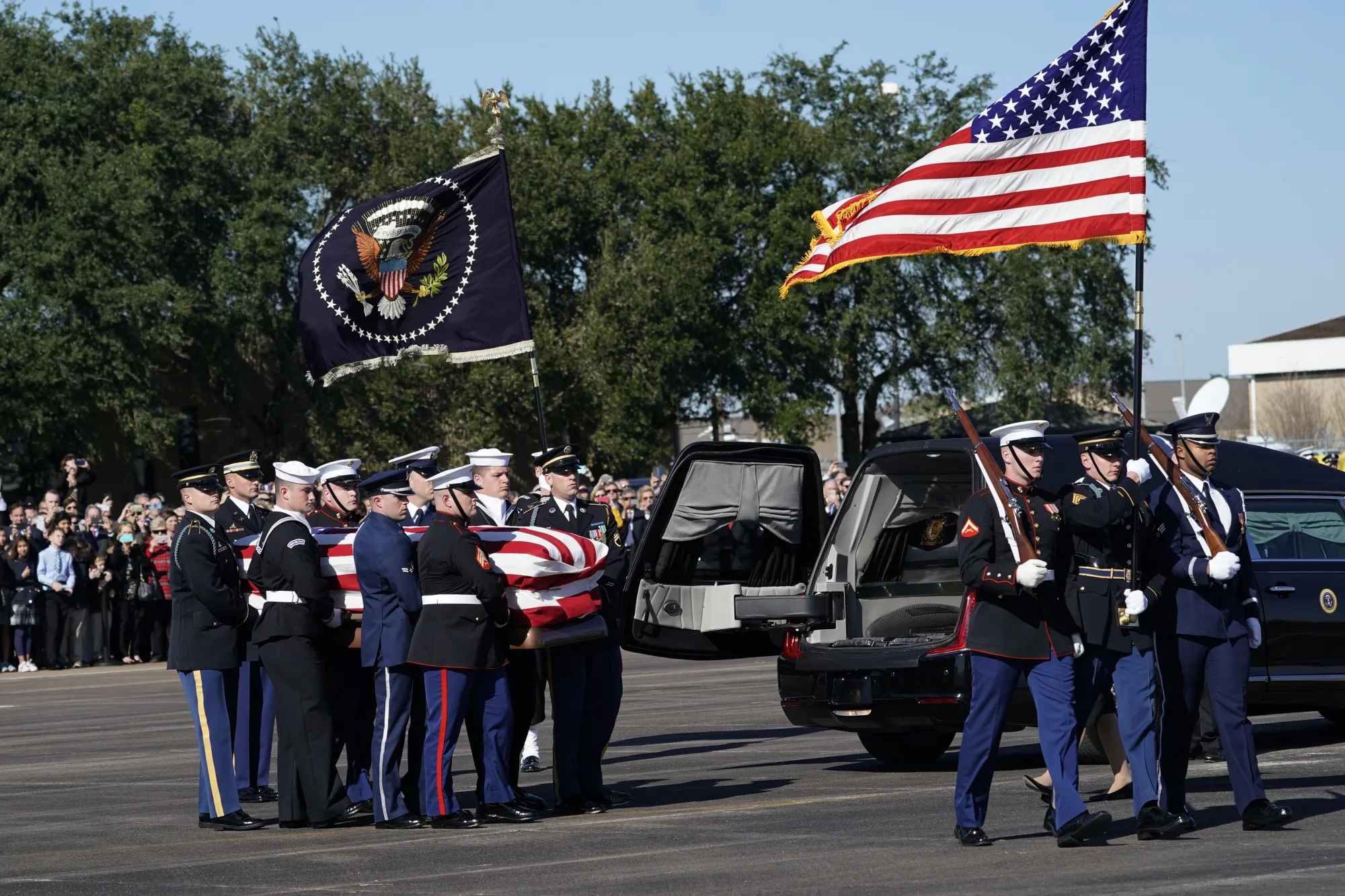 Joint services military honor guards carry the flag-draped casket of former U.S. President George H.W. Bush during a departure ceremony at Ellington Field in Houston&nbsp;on&nbsp;Dec. 3, 2018.