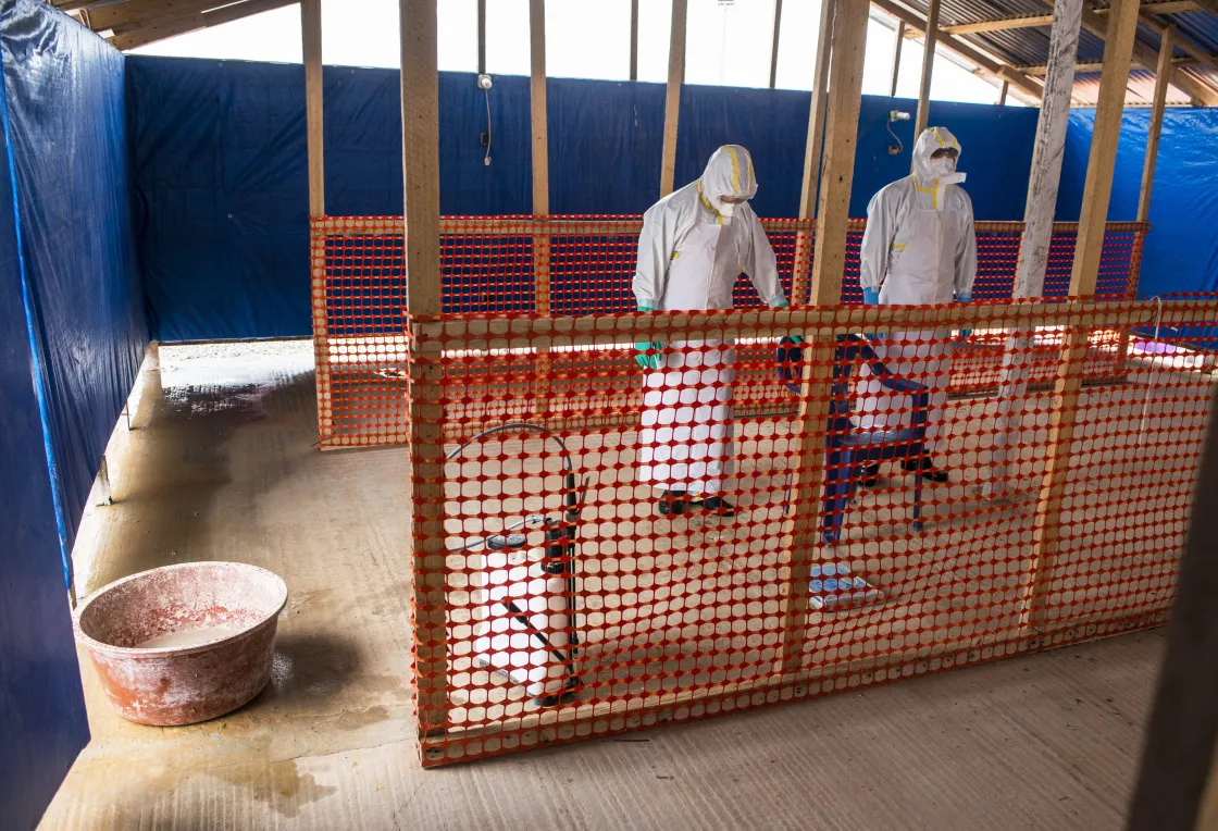 Healthcare workers in a tent at an Ebola Treatment Center in Coyah, Guinea in 2015.