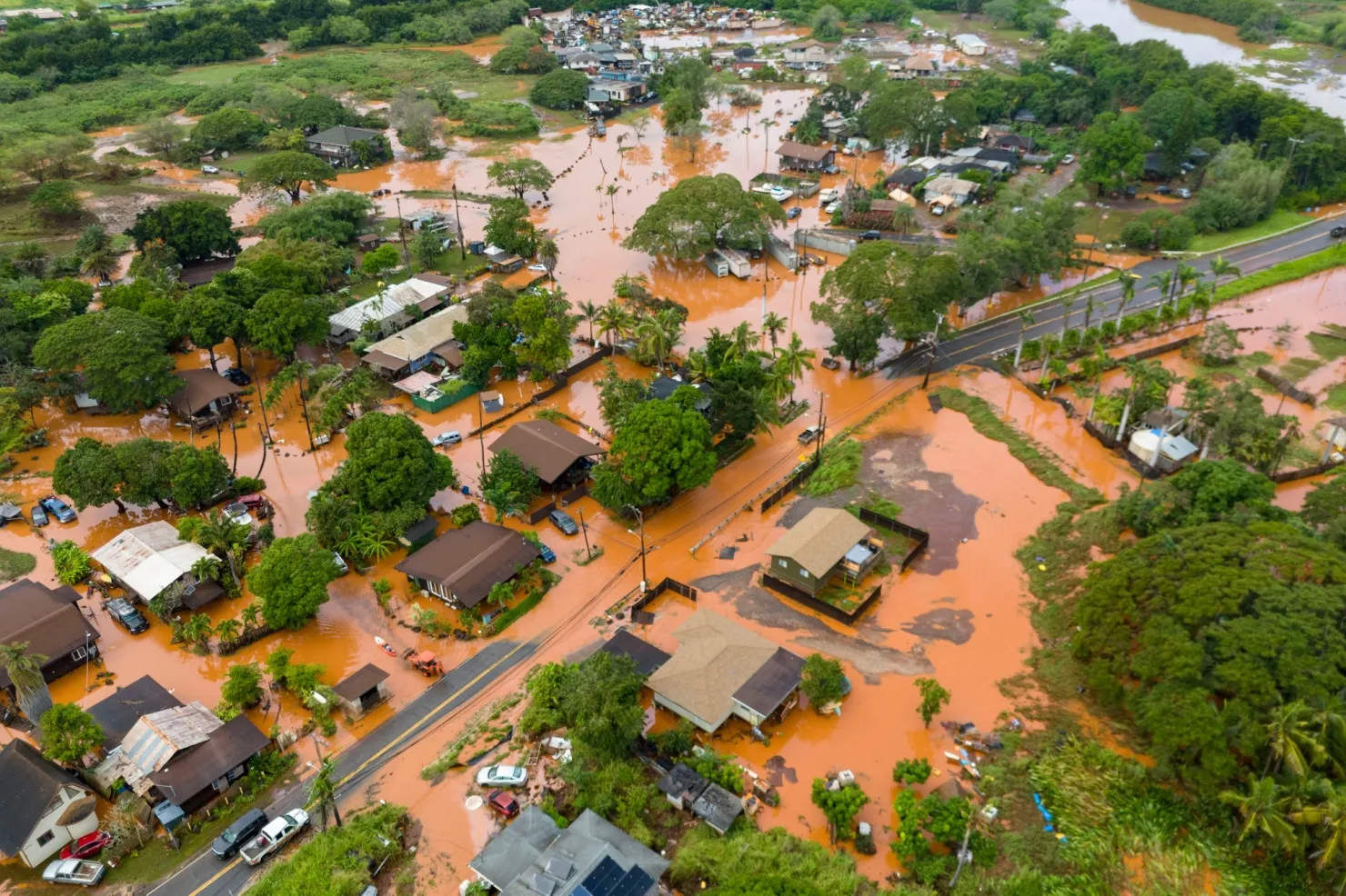 Fooding covers a residential neighborhood in Waialua, Hawaii, March 20.