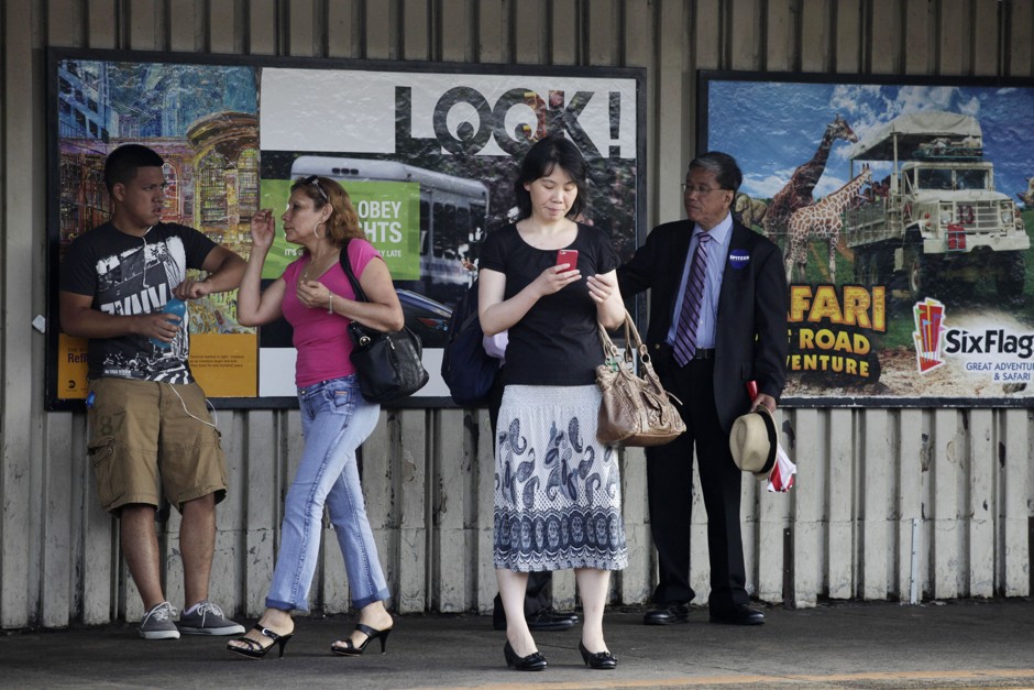 Passengers wait in the 82 Street Jackson Heights subway station in the Queens borough of New York City.