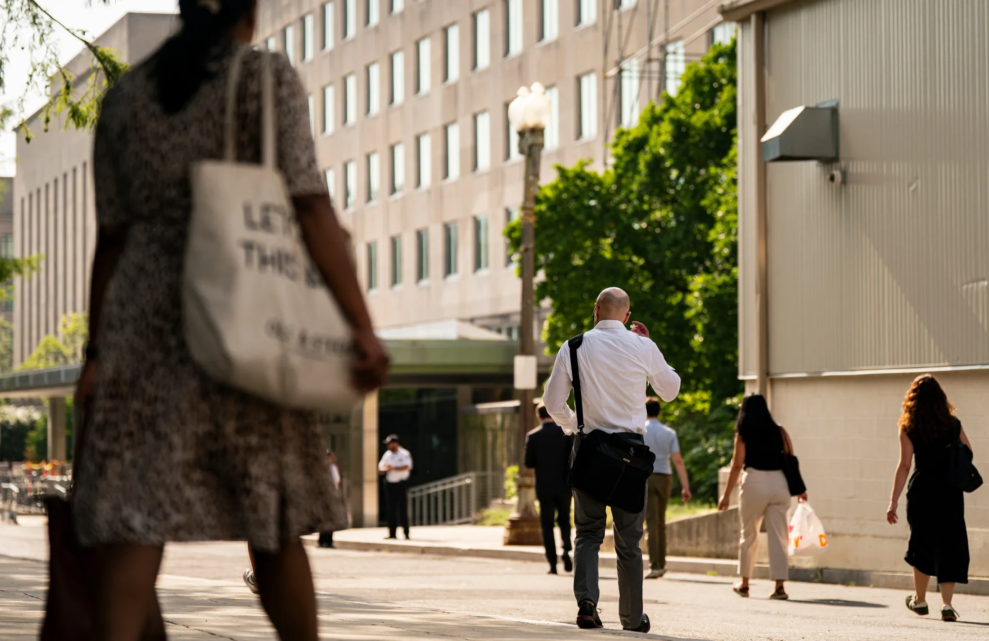 Workers arrive at the US State Department in Washington, DC, on July 11.