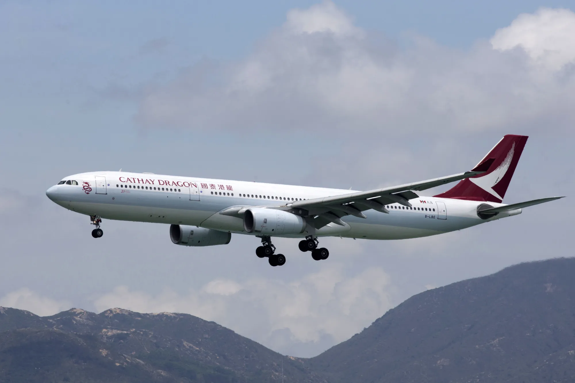 A Cathay Dragon aircraft prepares to land at Hong Kong International Airport.