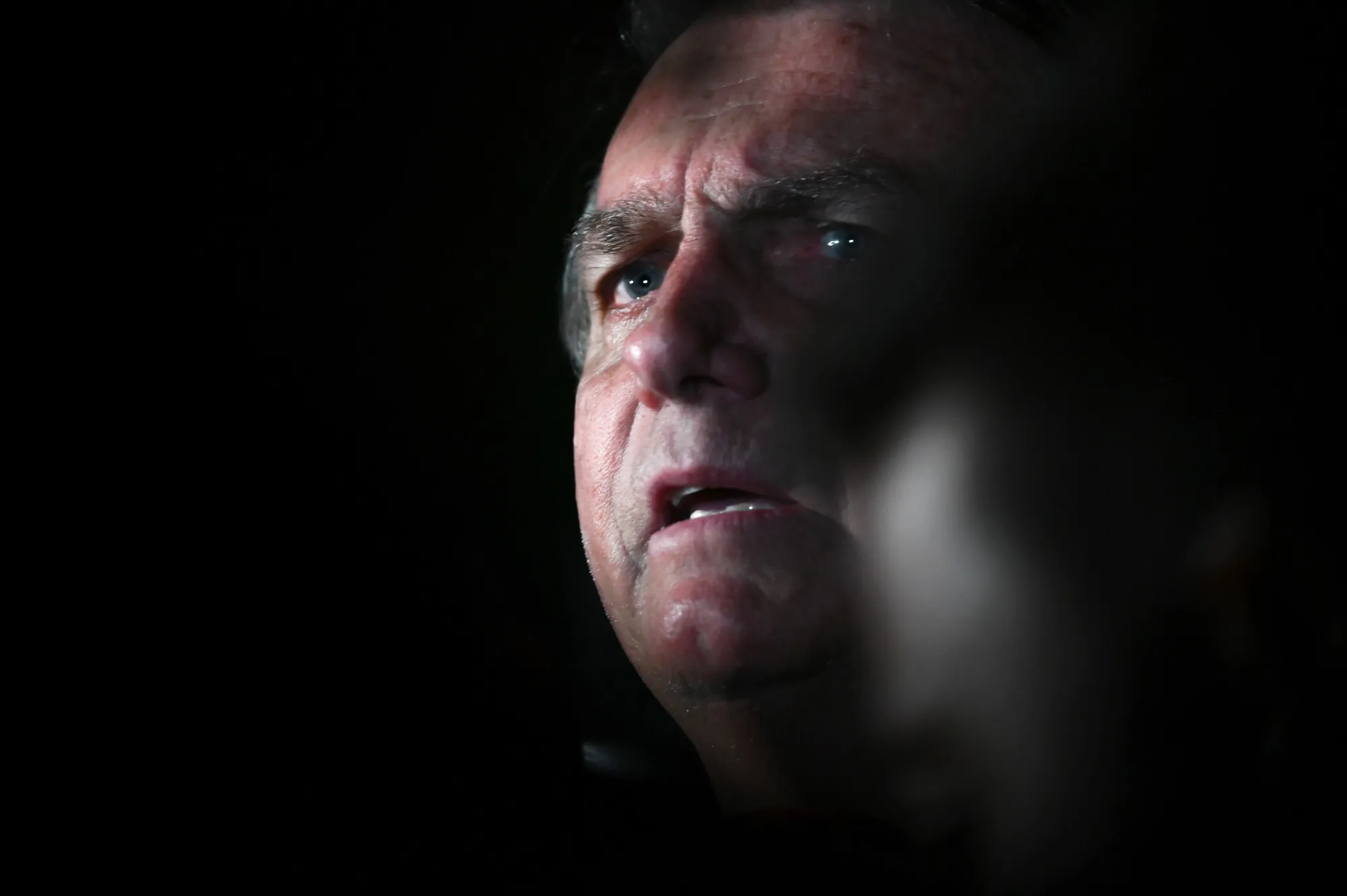 Former President Jair Bolsonaro speaks to members of the media following his ban from office in Brasilia on June 30.
