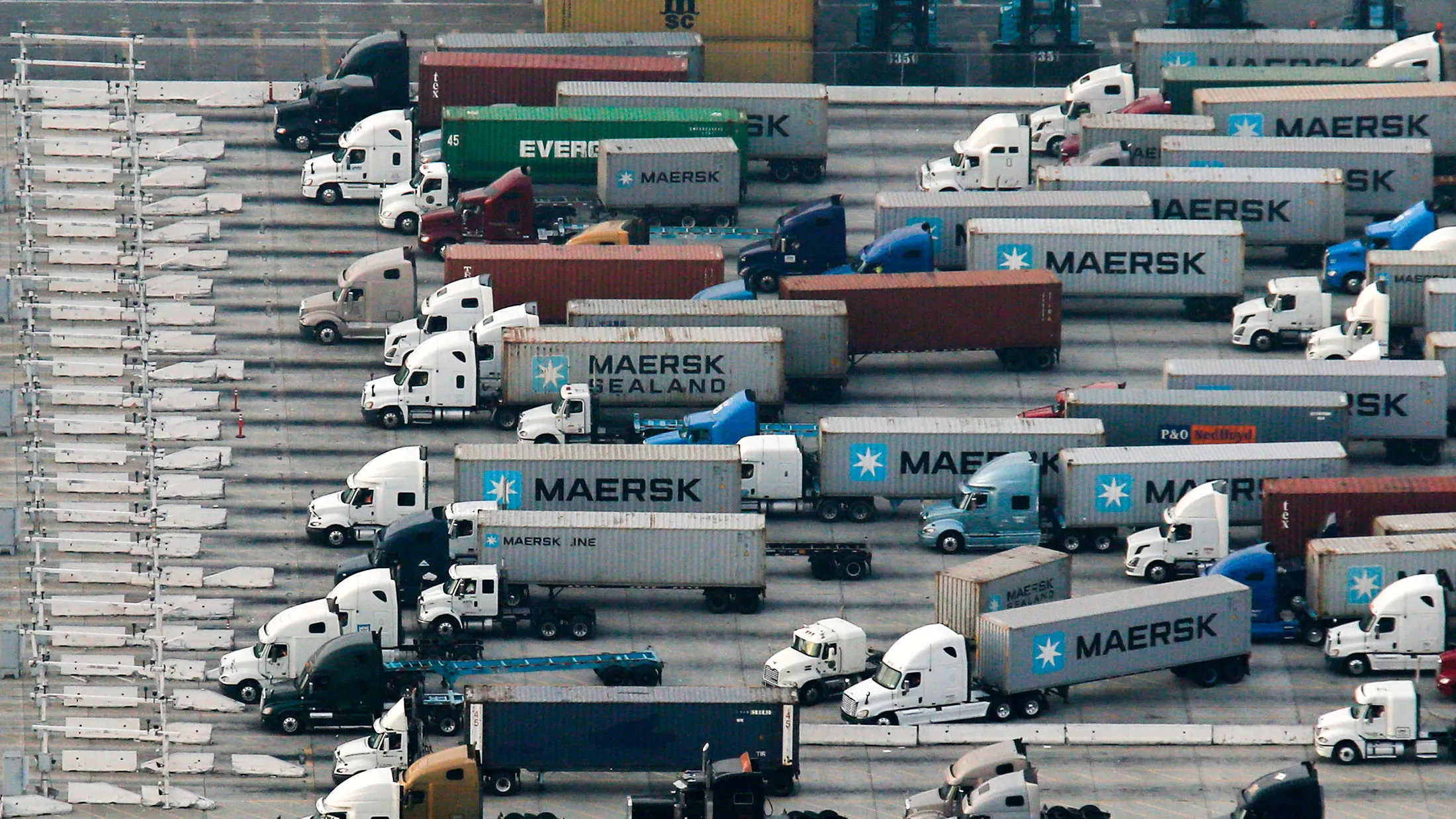 Transport trucks wait in line at the Port of Los Angeles in California.
