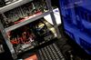 A graphic processing unit (GPU) cryptocurrency mining rig manufactured by Easy Crypto Hunter sits alongside a computer at the Crypto Investor Show in London, U.K., on Saturday, March 10, 2018. The meeting is the largest crypto and blockchain event for investors in the U.K.