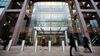 Pedestrians pass the Morgan Stanley headquarters at Canary Wharf in London, U.K., on Monday, Jan. 18, 2010.