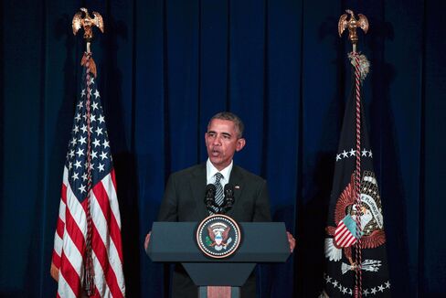 Barack Obama speaks during a news conference in Kuala Lumpur