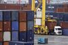 A crane loads a container onto a truck at a shipping terminal in Yokohama, Japan, on Thursday, July 11, 2019. Japan and South Korea plan to meet on Friday over Tokyo’s move to restrict vital exports to its neighbor, but neither has much political incentive to climb down from their worst dispute in decades.