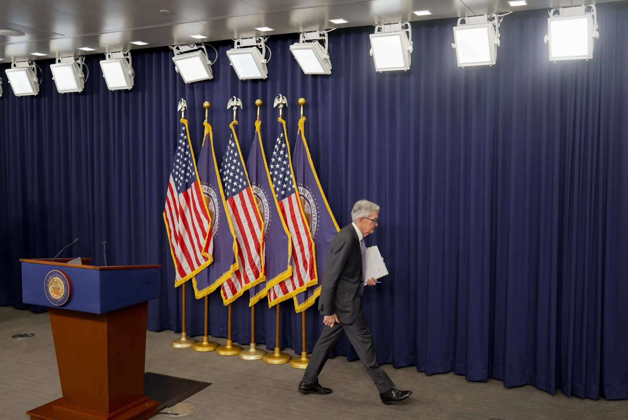 Jerome Powell, chairman of the US Federal Reserve, departs a news conference following a Federal Open Market Committee (FOMC) meeting in Washington, DC, US, on Wednesday, Dec. 10, 2025. Federal Reserve officials delivered a third consecutive interest-rate reduction and maintained their outlook for just one cut in 2026.