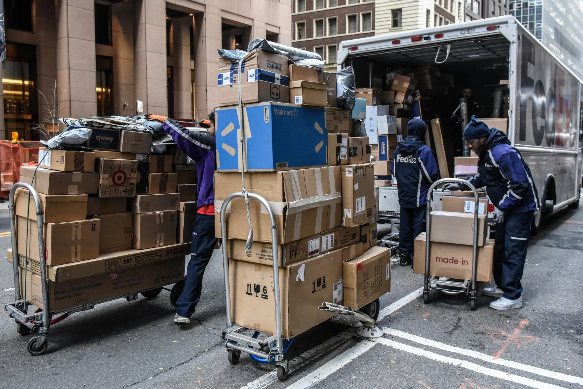 Contract workers&nbsp;deliver packages on Cyber Monday in New York on Nov. 27.