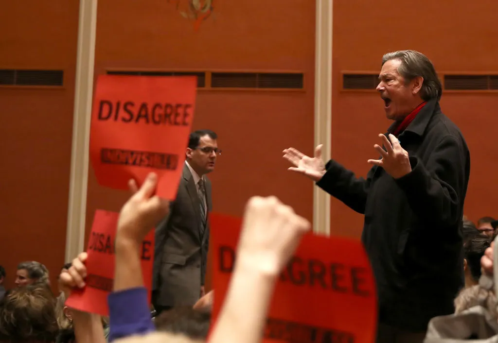 Asking a lawmaker questions at a town hall doesn't feel that empowering. Shouting at one might.
