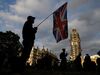 An anti-Brexit protester with a composite Union and EU flag is seen on Parliament Square outside the Houses of Parliament in central London on September 4, 2019.