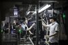 Workers assemble monitors at a TCL Corp. factory in Huizhou, Guangdong province, China, on Monday, April 18, 2016. Six years ago, if you bought an Apple iPhone or a pair of Nike sneakers, they probably came from Guangdong. But as the days of cheap land and labor recede, the province's businesses are in a race to upgrade or move.