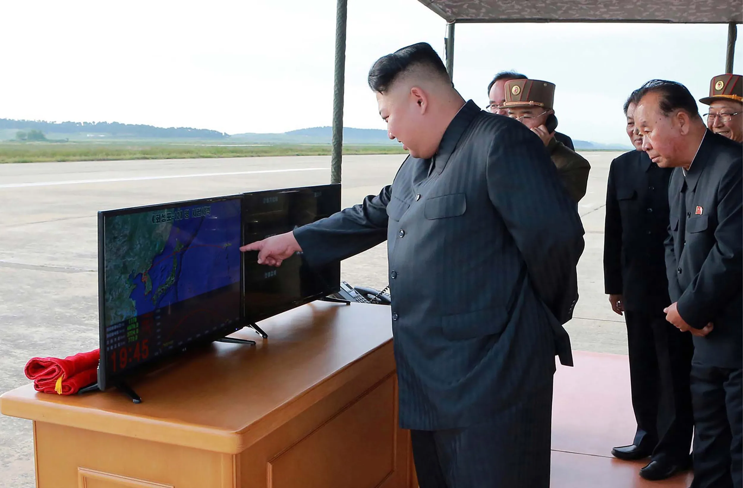 This undated picture released from North Korea's Korean Central News Agency in 2017, shows Kim Jong Un inspecting a launching drill of the medium-and-long range strategic ballistic rocket Hwasong-12.
