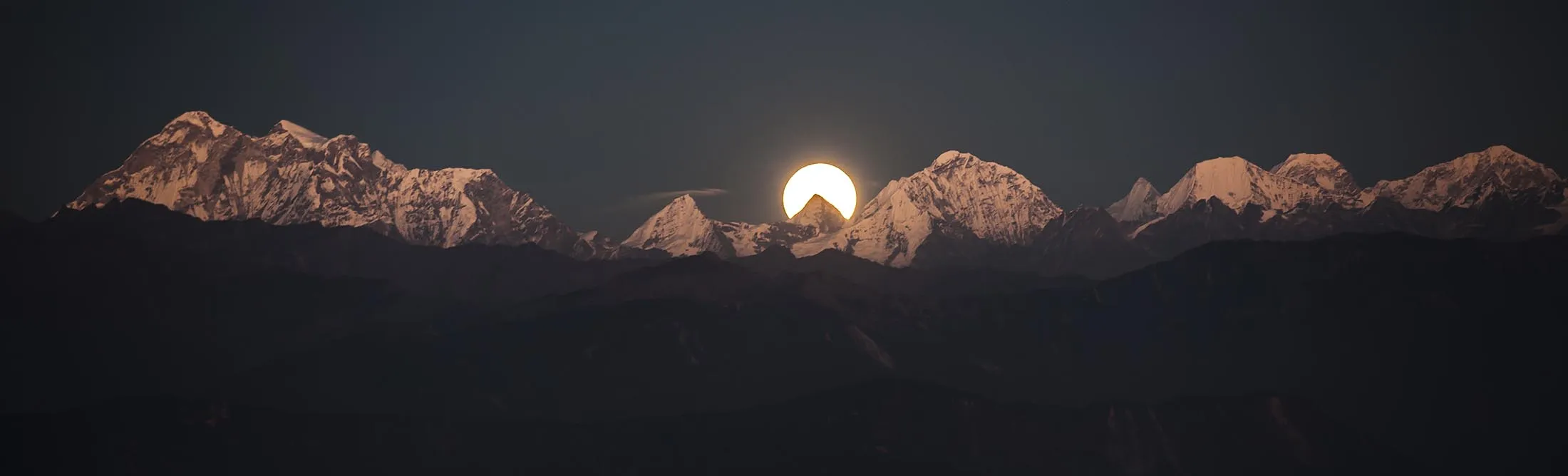 The Bright Moon Behind Ganesh Himal Mountain Range In Nepal