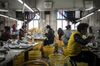 Employees sew shoe components in a factory in Wenzhou, China, on Monday, Jan. 14, 2019. The Chinese government's effort to pivot from being the world's supplier of goods to a nation that's increasingly competing for technological dominance is shaking up the global order.
