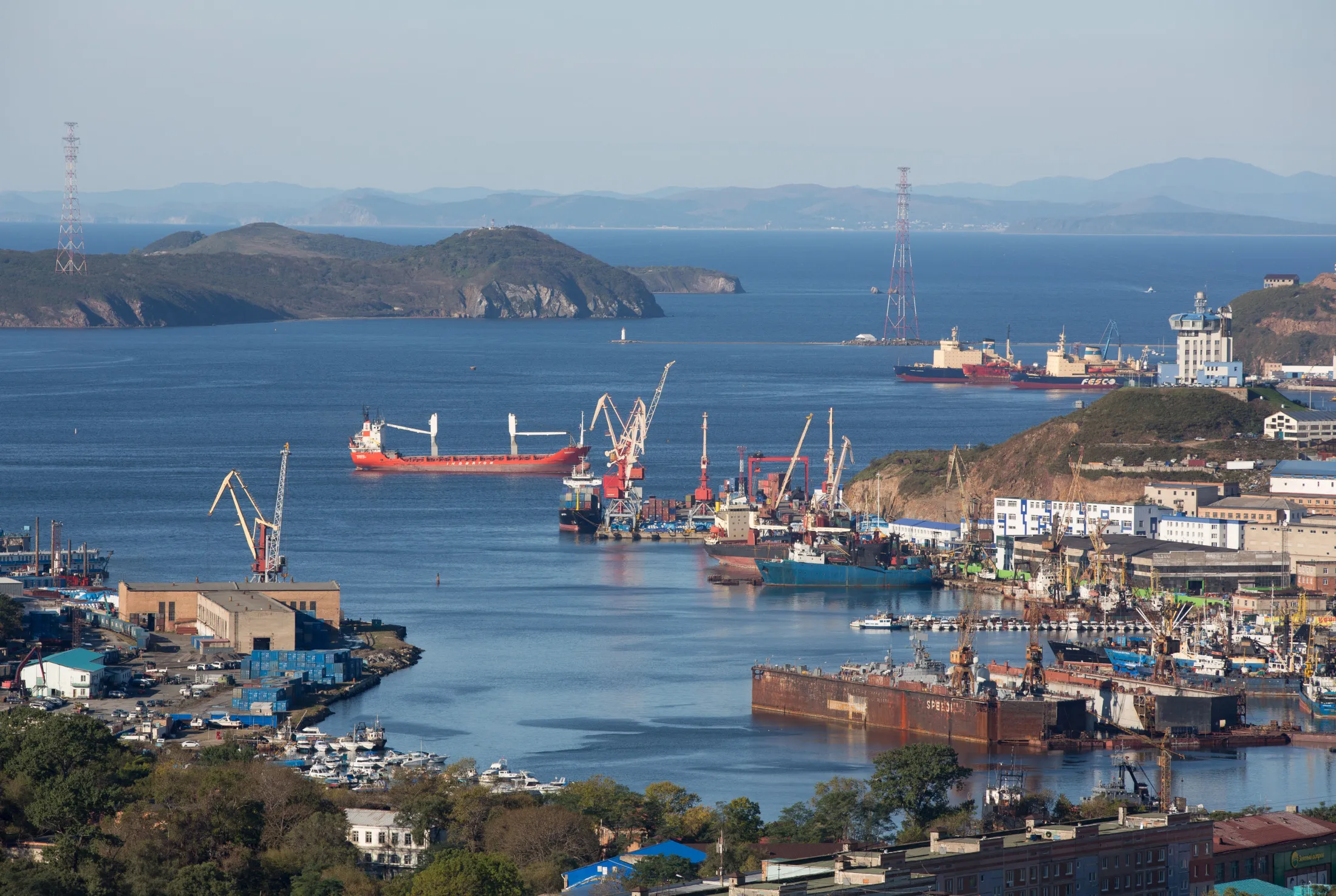 Commercial shipping vessels at Bay Diomid in Vladivostok, Russia.