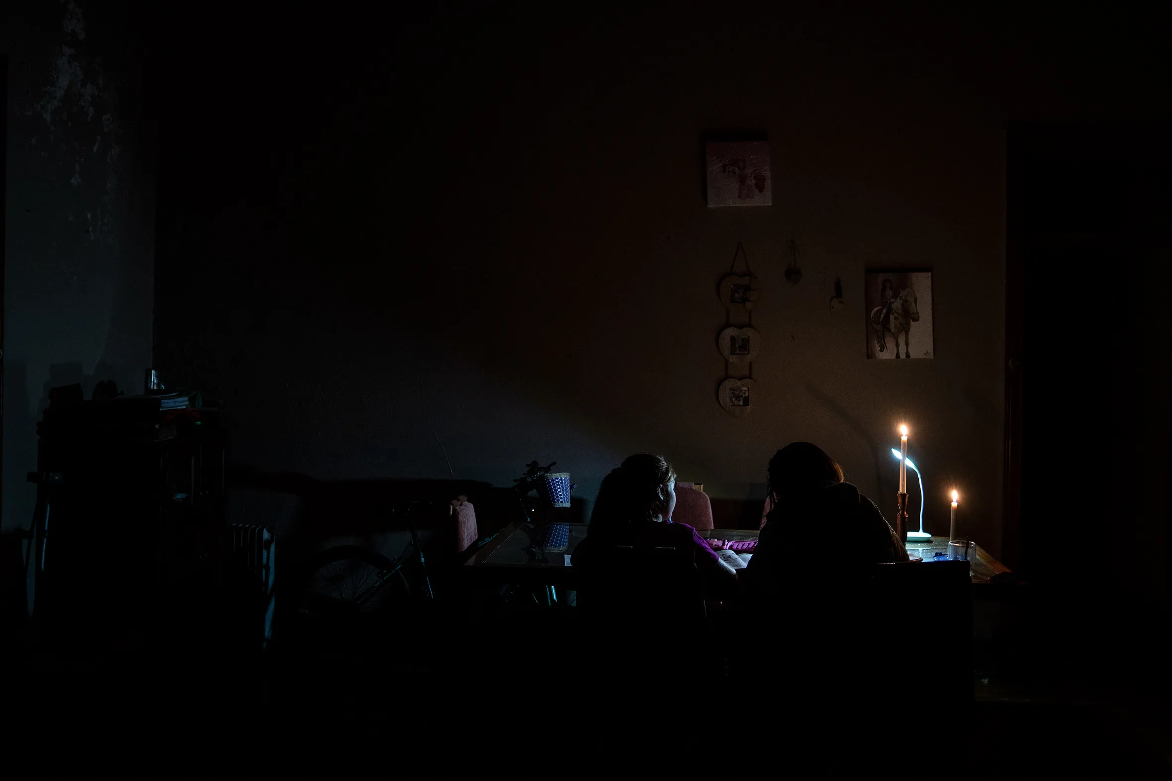 A woman and her daughter&nbsp;do homework during a loadshedding period&nbsp;in Frankfort, South Africa.&nbsp;