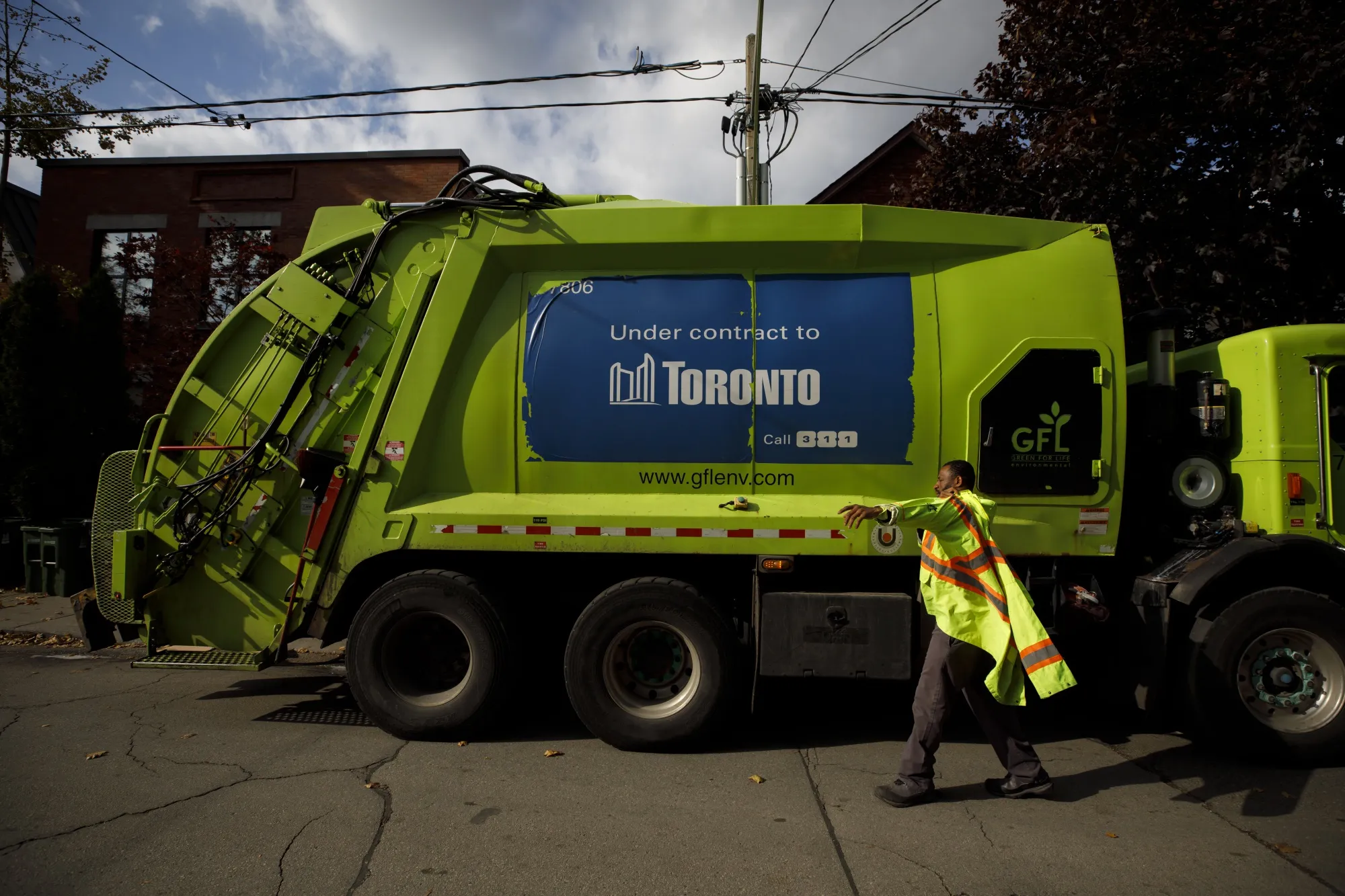 A GFL Environmental Inc. garbage truck during morning waste pickup in&nbsp;a residential neighborhood in Toronto on Oct. 24, 2019.&nbsp;