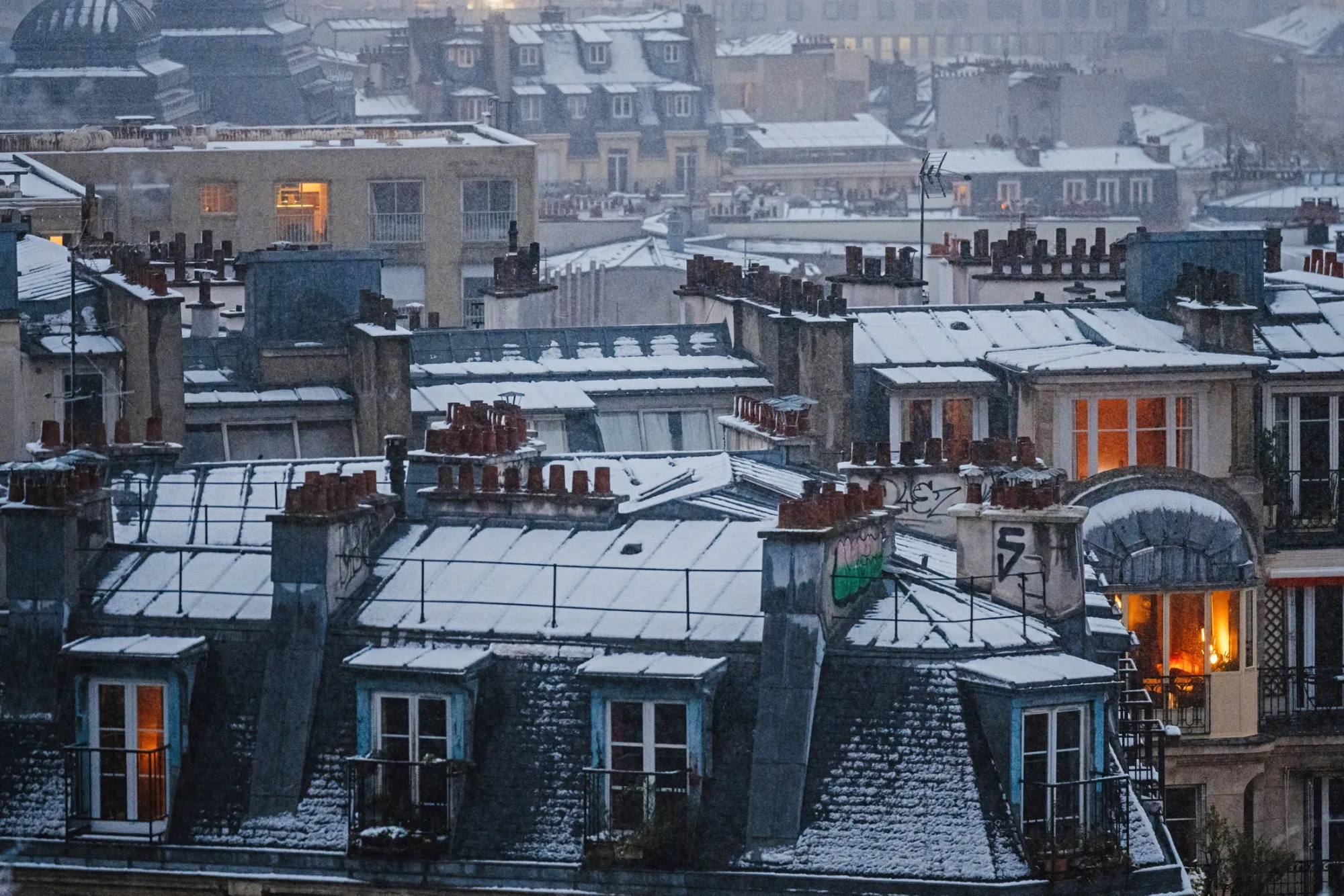 Snow-covered roofs in Paris.