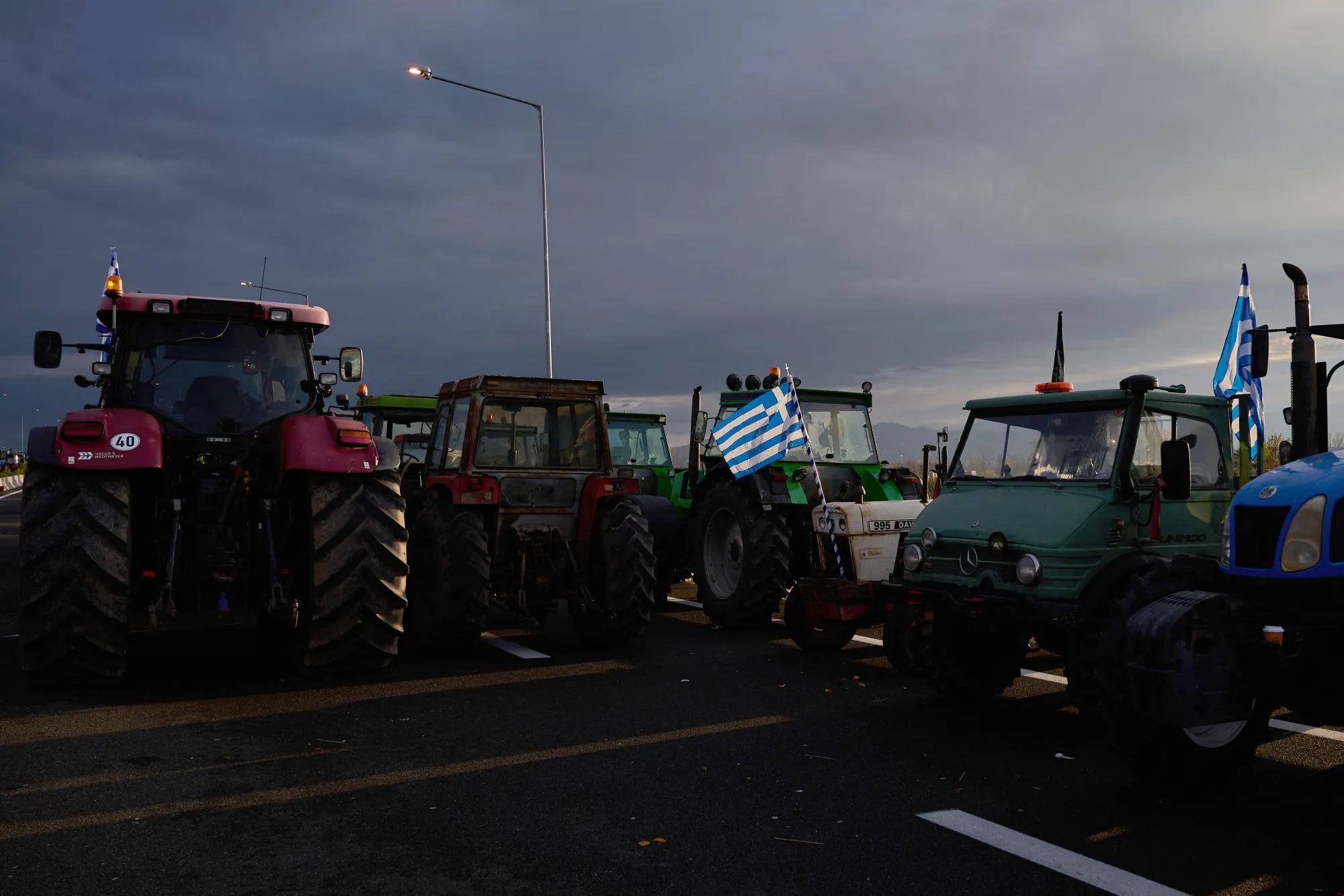 Greek farmers block the national highway outside the central Greek city of Karditsa on Dec. 8.