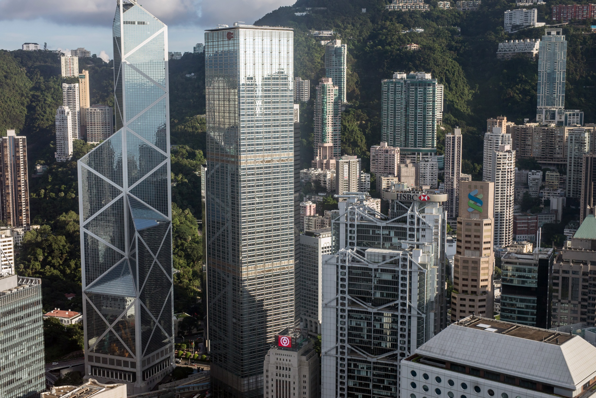 The Bank of China Tower, from left, the Cheung Kong Center building, the HSBC Holdings Plc headquarters building and the Standard Chartered Bank building stand in the central business district of Hong Kong.
