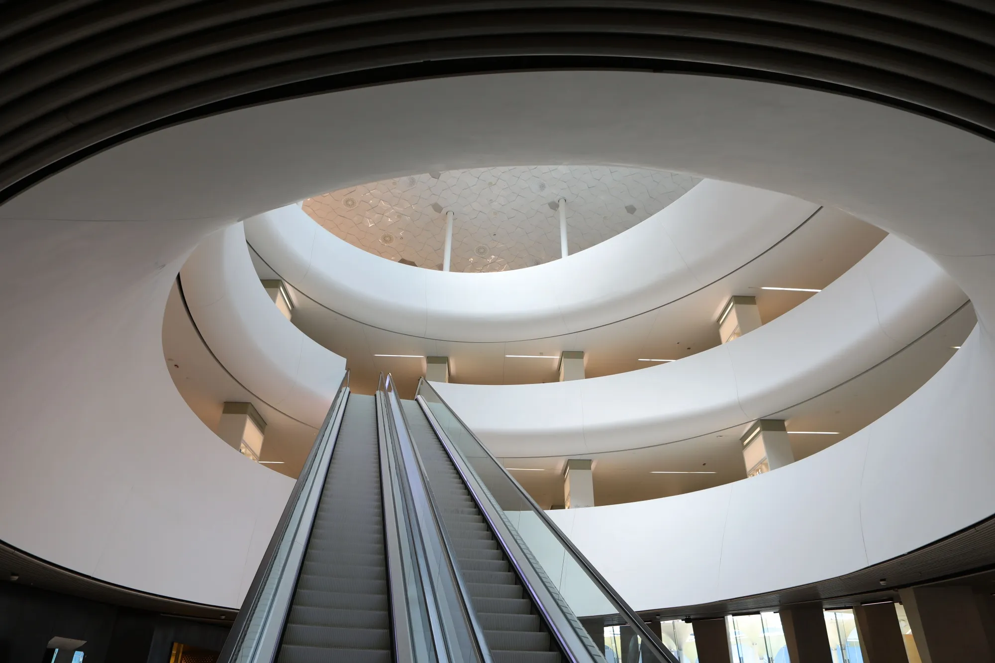Escalator and atrium at the King Abdulaziz Center for World Culture&nbsp;in Dhahran, Saudi Arabia, where Saudi Aramco has its headquarters.