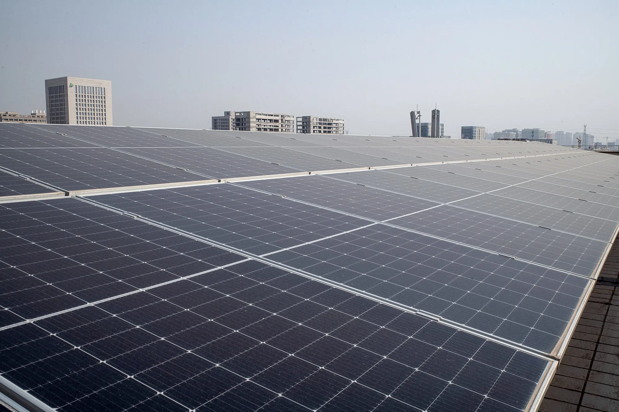 Longi solar panels on the rooftop of an office building in Xi'an.
