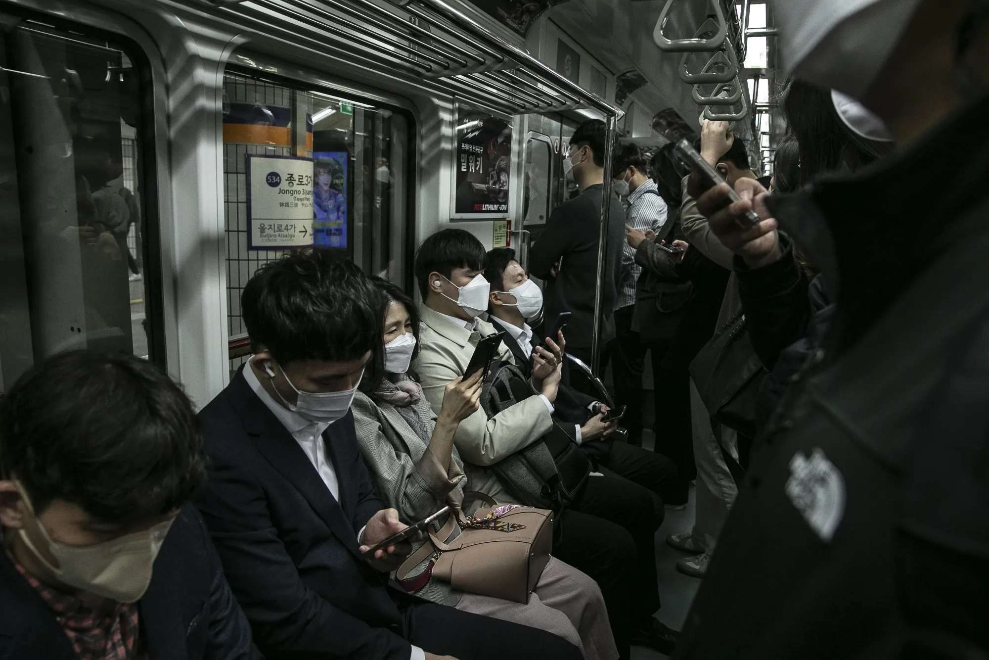 Morning commuters on a subway in Seoul, earlier in April.