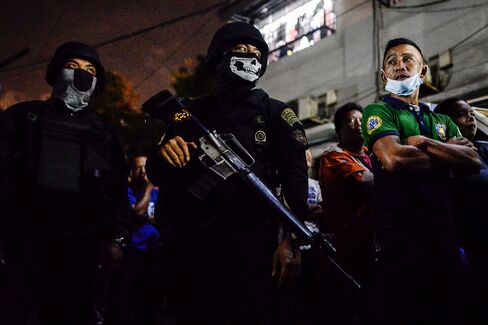 Armed guards outside a Manila jail where a blast killed 10 inmates on Aug. 12.