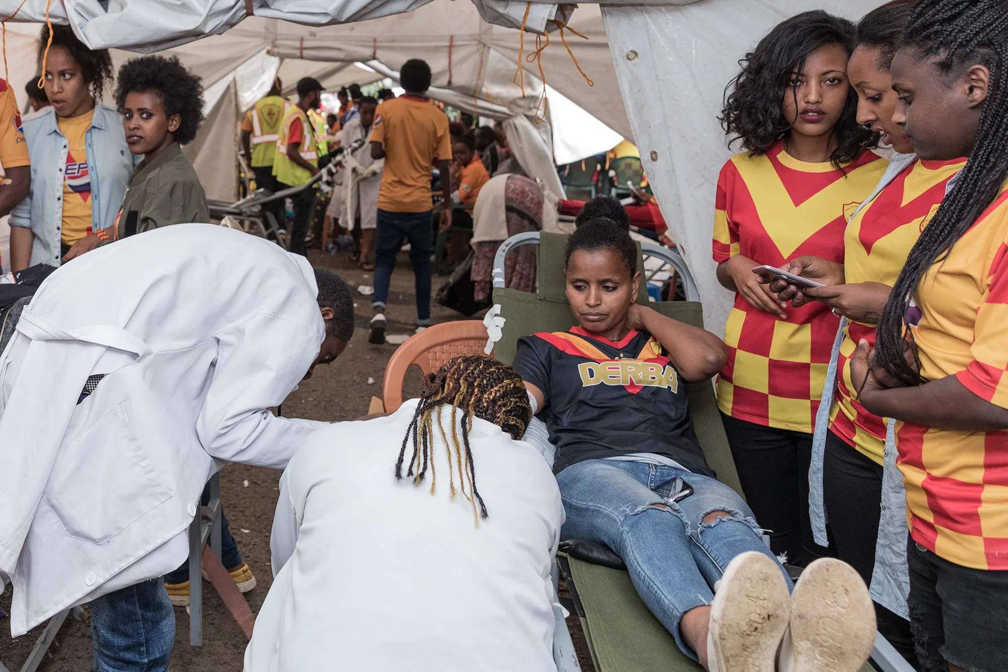 People donate blood at Ethiopia Red Cross in Addis Ababa, on June 24, 2018, to help injured victims of the blast which occurred the day before.