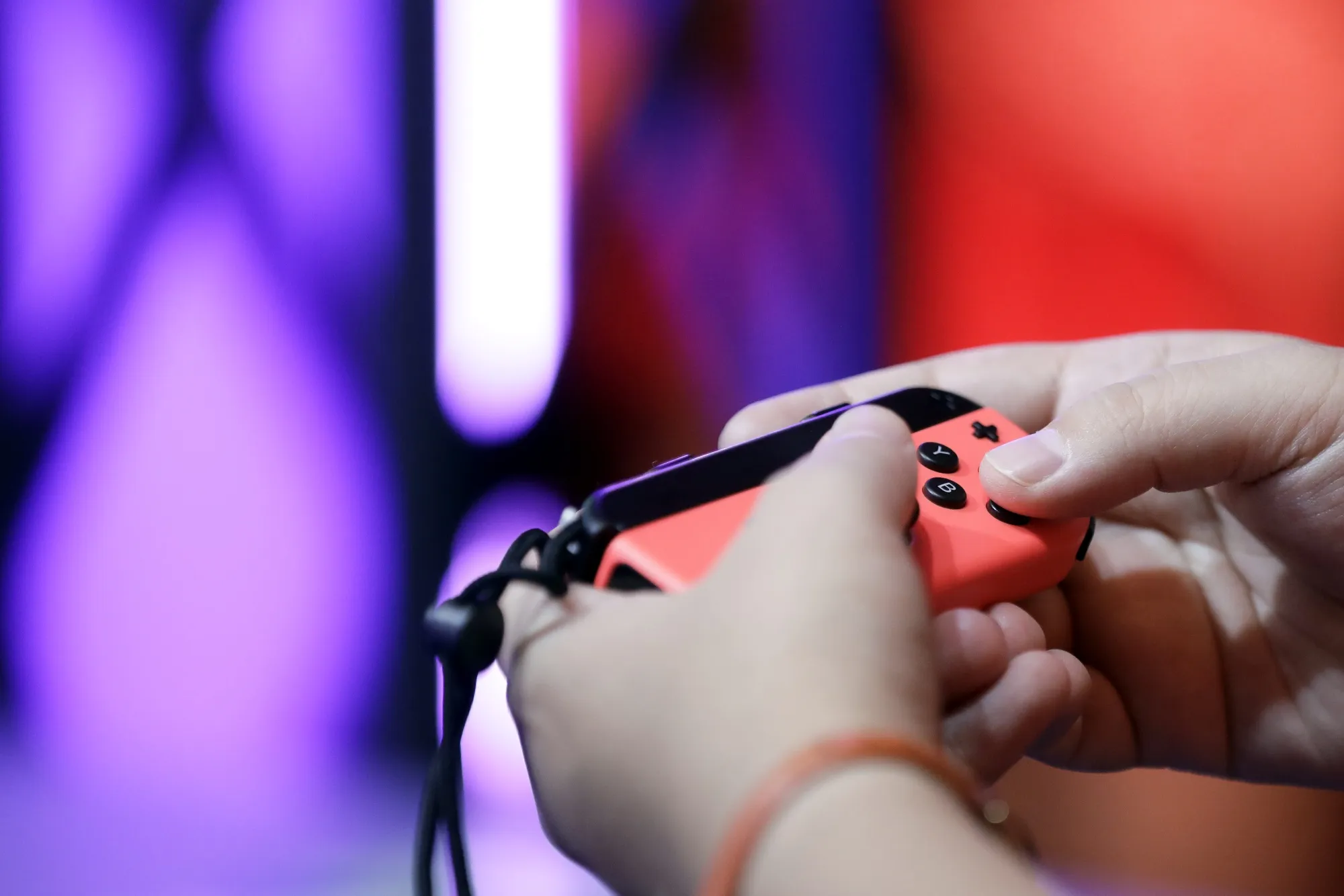 An attendant uses the Joy-Con controller for a Nintendo Co. Switch game console.