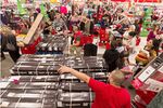 Shoppers wait to get one television per customer deal at Target store in Burbank, California on Nov. 22, 2012