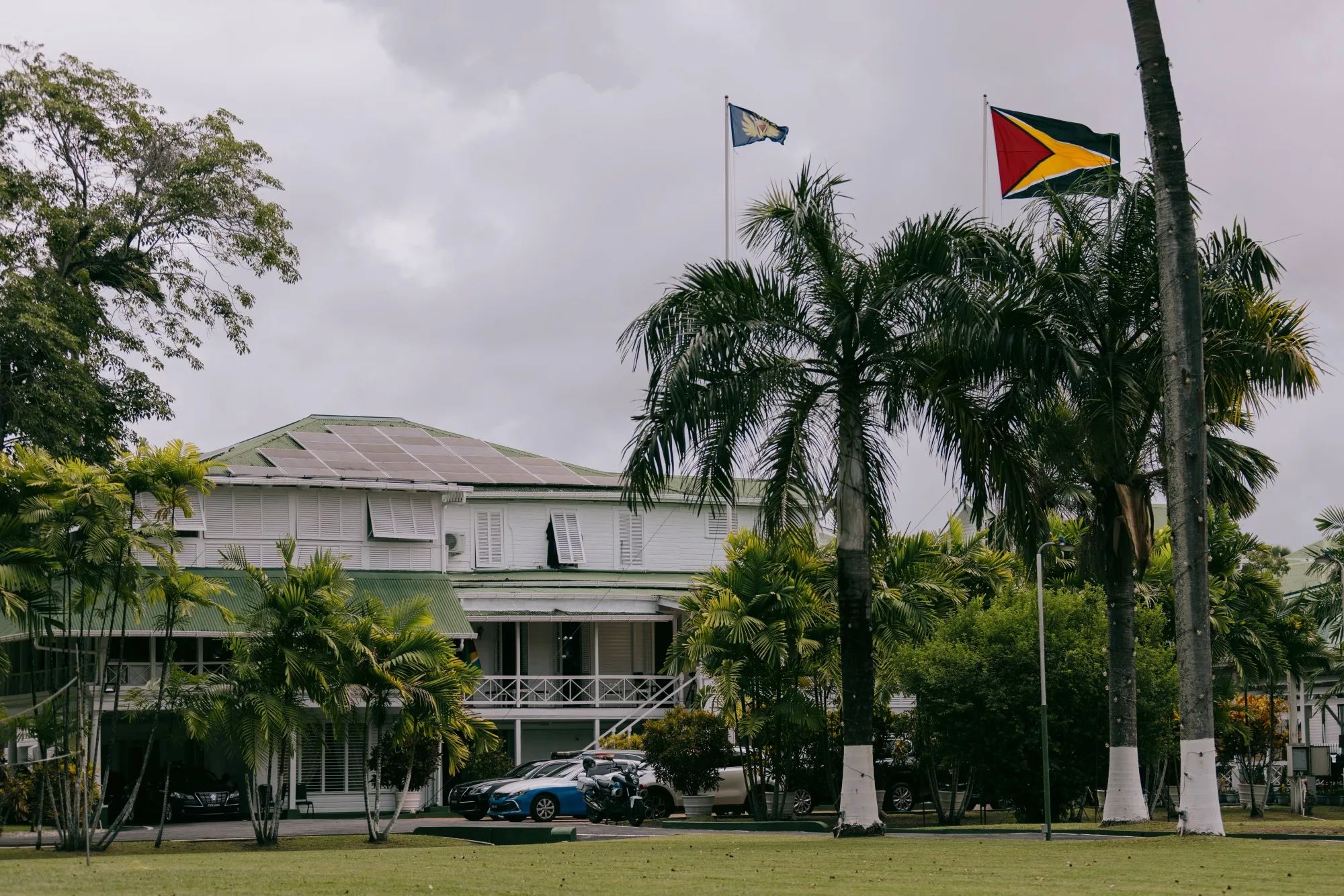 The Guyanese national flag above the State House in Georgetown, Guyana.