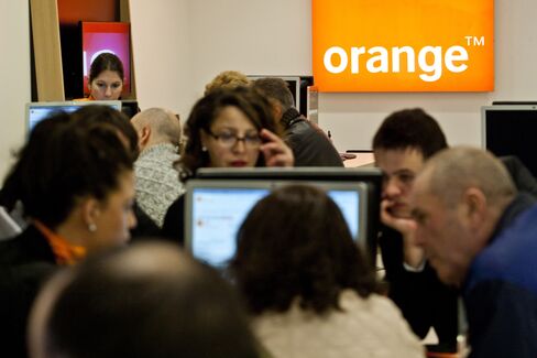 Shoppers Browse Products Inside the Orange SA Store in Toulouse